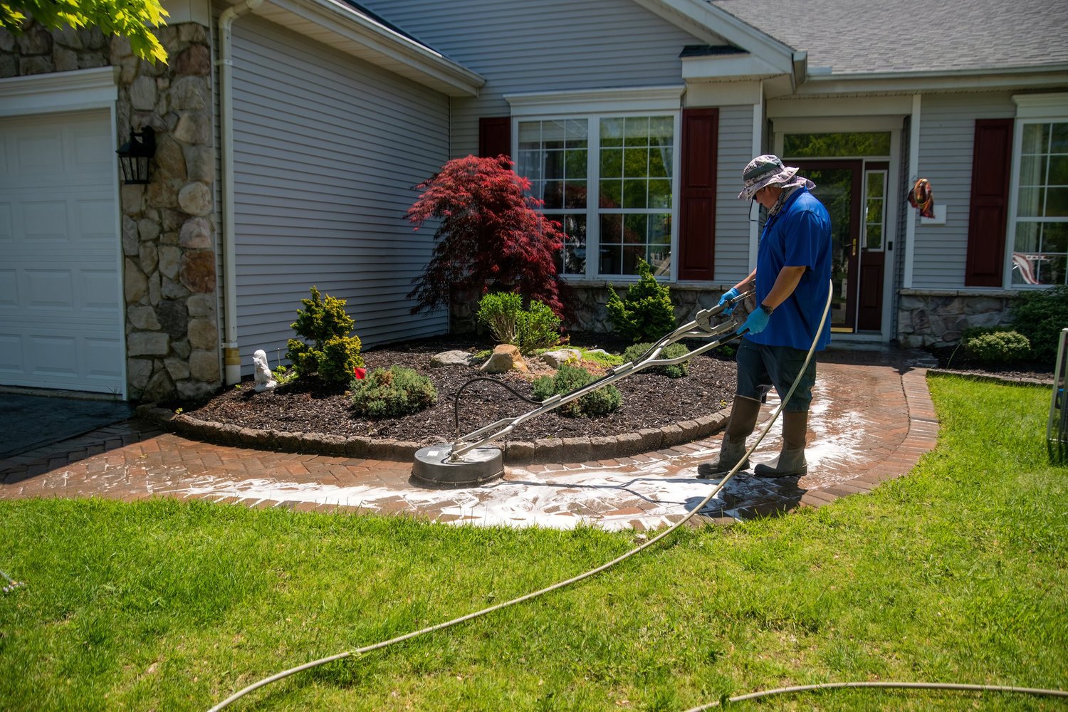 Soft washing front walkway and home exterior