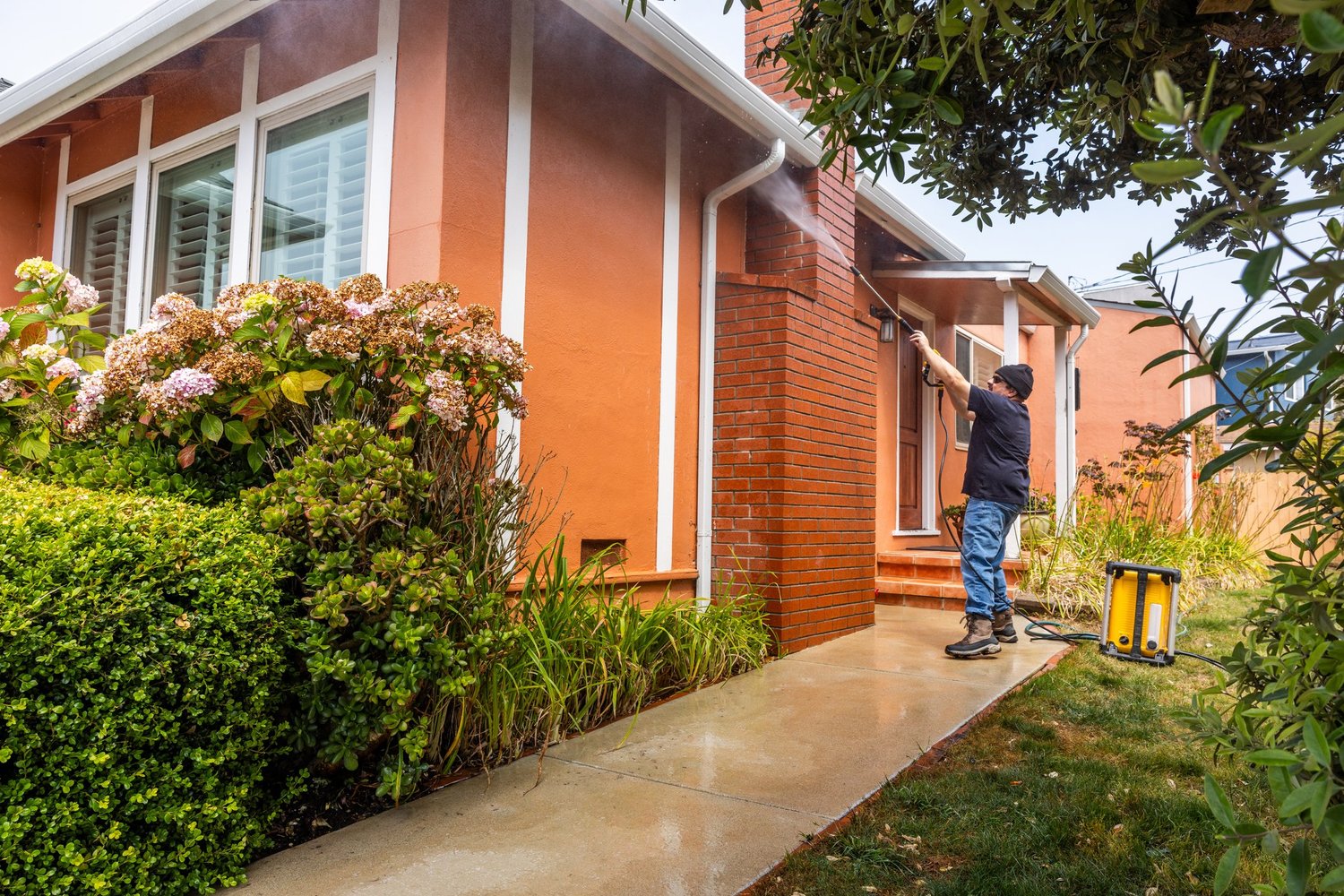 Soft washing exterior of a brick home